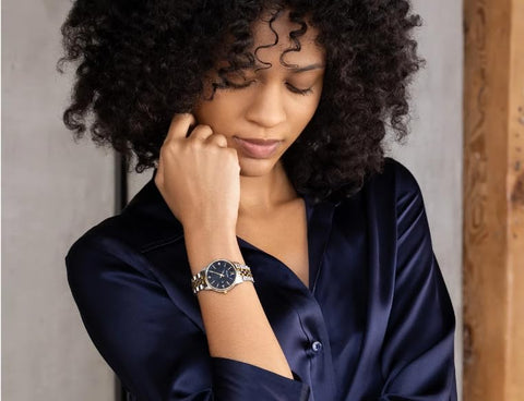 Bulova Ladies' Classic Diamond Two-Tone Gold Stainless Steel 3-Hand Calendar Date Quartz Watch, Black Dial Style: 98P198 Bulova