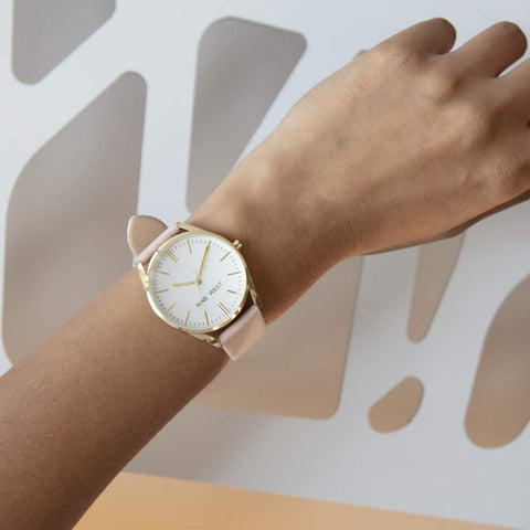 Nine West Women's NW/1994WTPK Gold-Tone and Pastel Pink Strap Watch