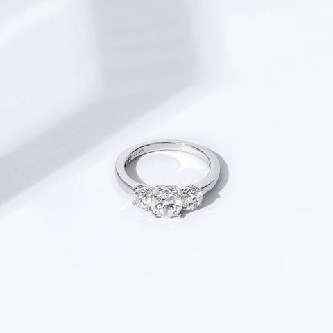 Amazon Essentials Platinum-Plated Sterling Silver Round 3-Stone Ring made with Infinite Elements Cubic Zirconia (2 cttw), Size 7 (previously Amazon Collection) Amazon Essentials