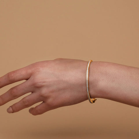 PAVOI 14K Gold Plated Cubic Zirconia Bangle Classic Tennis Bracelet | Yellow Gold Bracelets for Women | 7.5 Inches